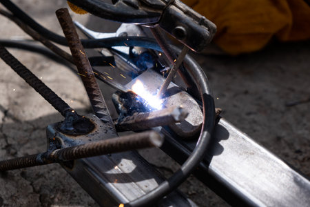 Welding work outdoors in a private house close-up.の写真素材