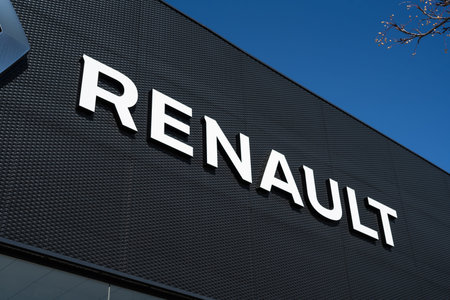 Tarragona, Spain - February 02 2023: Renault logo on a black signboard of a car dealership close-up.