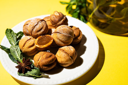 Homemade nut cookies with condensed milk on a yellow background.の写真素材
