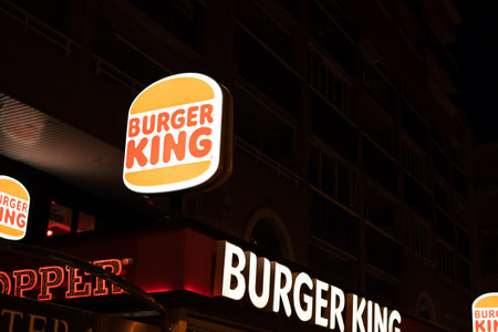 Tarragona, Spain - 09 June 2023: Burger King Signs Entrace Building. Burger King restaurant exterior at night.のeditorial素材