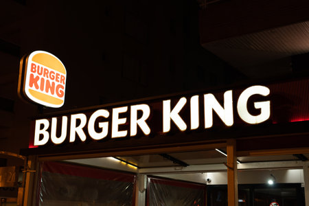 Tarragona, Spain - 09 June 2023: Burger King Signs Entrace Building. Burger King restaurant exterior at night.のeditorial素材