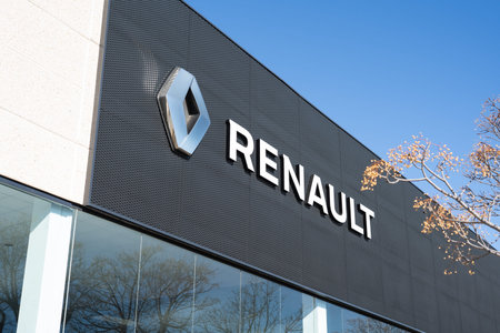 Tarragona, Spain - February 02 2023: Renault logo on a black signboard of a car dealership close-up.