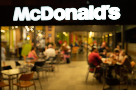 Tarragona, Spain - 09 June 2023: Blurred photo. McDonalds Arches sign as seen at McDonalds fast food...
