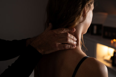 Close-up of male hands doing lymphatic drainage massage on a female neck.の写真素材