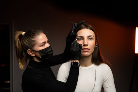An engaging eyebrow styling session showcasing precision and artistry through innovative techniques