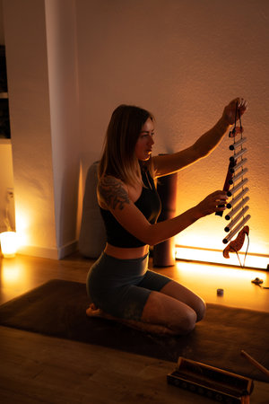 Experience a calming and rejuvenating Yoga session with Sound Bowl Meditation as dusk fallsの写真素材