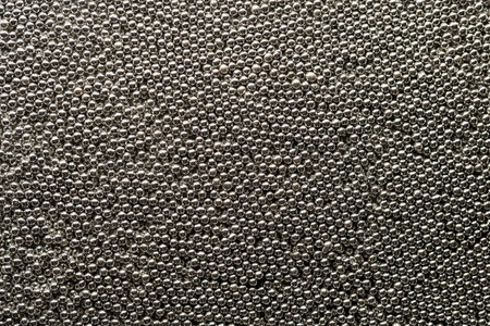 Texture of small metallic silver balls top view.の写真素材