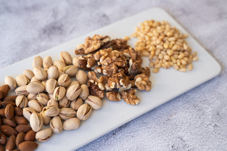 A Beautiful Variety of Nuts Arranged on a Serving Board for Healthy and Delicious Snacking Options