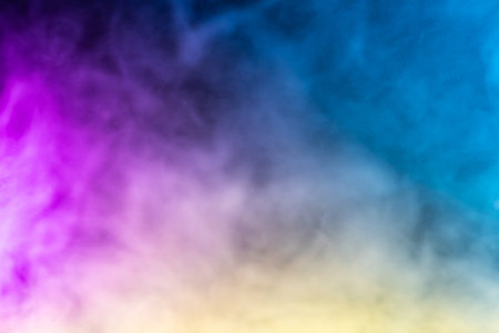 Blurred photo texture of colored smoke on a black background.の写真素材