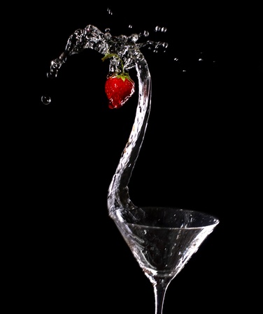 Martini strawberry splash on blackの写真素材