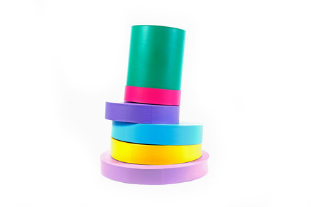 Round box for flowers with colorful lids on a white background