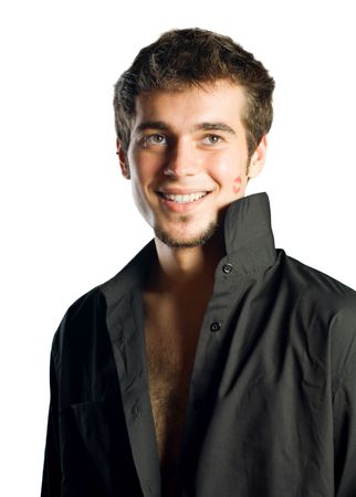Young happy smiling man with lipstick kiss, isolated on white backgroundの写真素材
