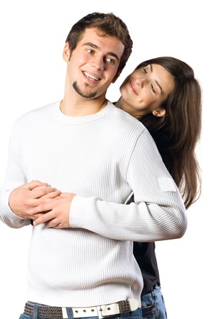 Isolated young attractive happy smiling amorous couple embracing の写真素材