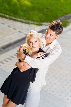 Young happy attractive embracing couple, outdoorsの写真素材