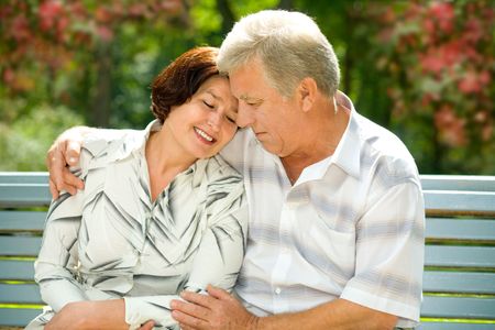 Mature attractive happy couple together in parkの写真素材