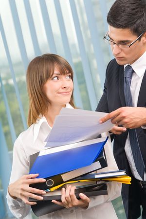 Two businesspeople working together at officeの写真素材