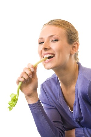 Young happy smiling woman with celery, isolated on whiteの写真素材