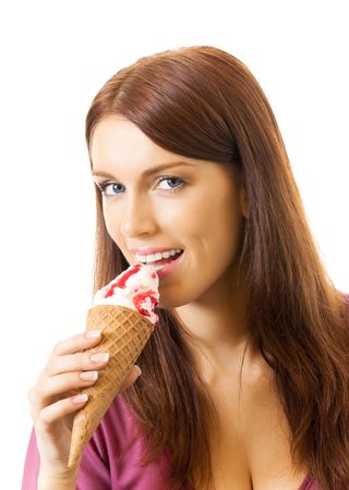 Young happy woman eating ice-cream, isolated on whiteの写真素材