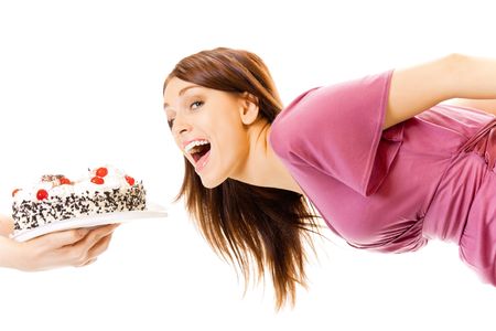 Young hungry gluttonous woman eating pie, isolated on whiteの写真素材