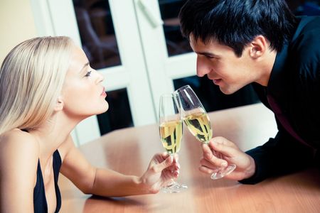 Couple on romantic date or celebrating together at restaurantの写真素材