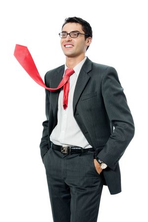 Happy smiling successful businessman with raised red tie, isolated on white backgroundの写真素材