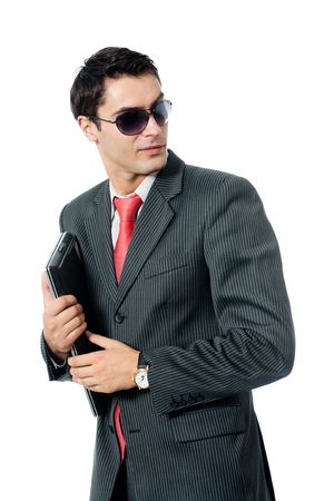 Businessman or hacker in sun glasses with laptop, isolated on white backgroundの写真素材