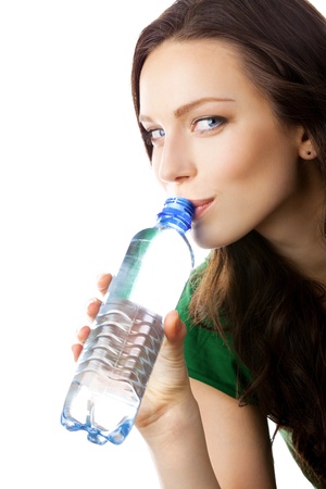 Woman drinking water from bottle, isolated on white backgroundの写真素材