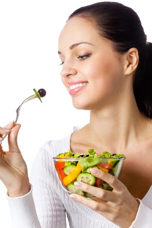 Portrait of happy smiling woman with vegetarian vegetable salad, isolated on white backgroundの写真素材