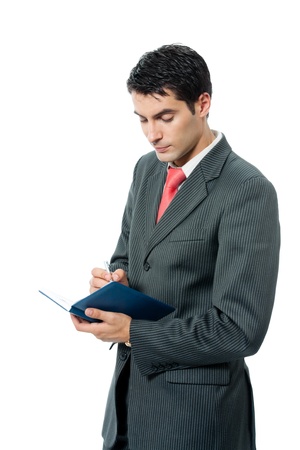 Portrait of happy smiling businessman with organizer, isolated on white backgroundの写真素材