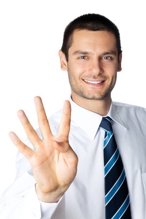 Portrait of happy smiling businessman showing four fingers, isolated on white backgroundの写真素材