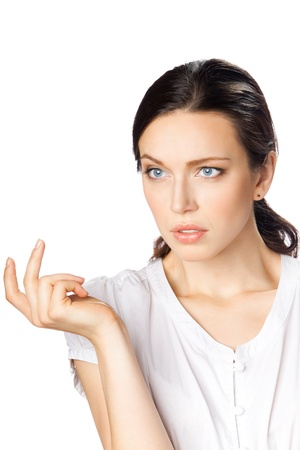 Portrait of puzzled thinking young businesswoman, isolated on white backgroundの写真素材