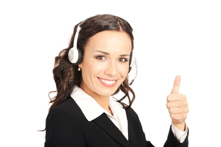 Portrait of happy smiling cheerful customer support phone operator in headset showing thumbs up gesture, isolated on white backgroundの写真素材