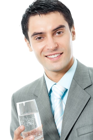 Portrait of happy smiling young business man with glass of water, isolated on white backgroundの写真素材