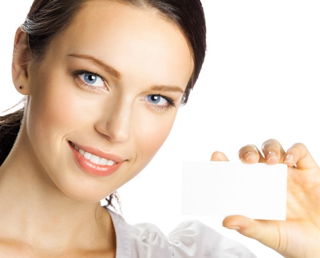 Portrait of smiling business woman giving blank business card, isolated over white backgroundの写真素材