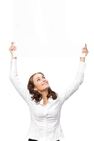 Happy smiling young business woman showing blank signboard, placard or banner, isolated over white backgroundの写真素材