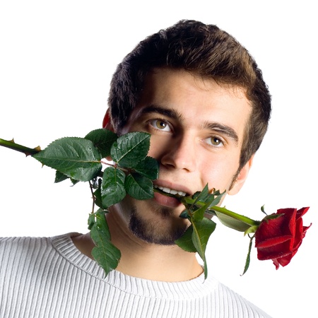 Young attractive man with rose, isolated over white backgroundの写真素材