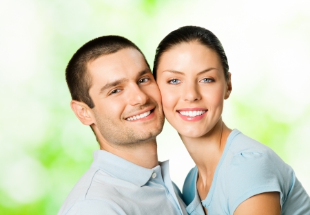Portrait of young happy smiling attractive couple, outdoorsの写真素材