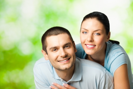 Portrait of young happy smiling attractive couple, outdoorsの写真素材