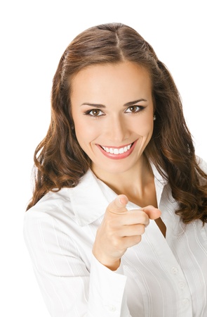 Portrait of young happy smiling business woman pointing finger at viewer, isolated over white backgroundの写真素材