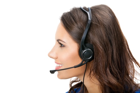 Portrait of happy smiling cheerful beautiful young support phone operator in headset, isolated over white backgroundの写真素材