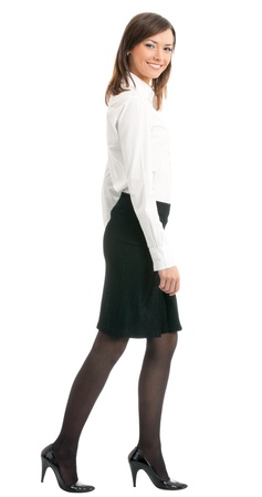 Full body portrait of walking business woman, isolated over white backgroundの写真素材