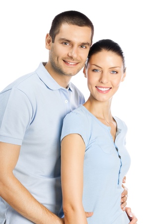 Portrait of young happy smiling attractive couple, isolated over white backgroundの写真素材