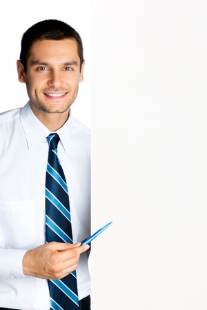 Happy smiling young business man showing blank signboard, isolated over white backgroundの写真素材