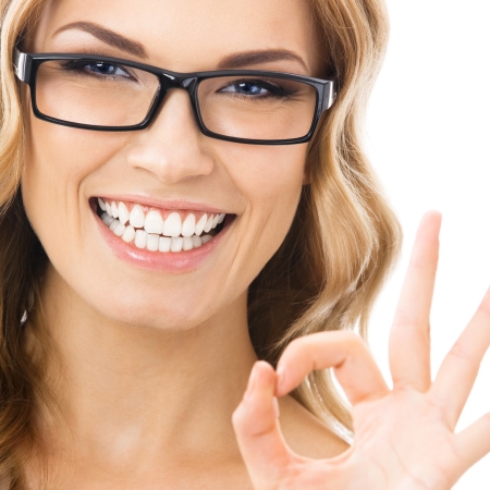 Happy smiling business woman with okay gesture, isolated over white background Happy smiling business woman with okay gesture, isolated over white background