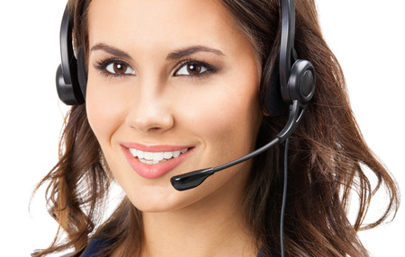 Portrait of happy smiling cheerful beautiful young support phone operator in headsetの写真素材