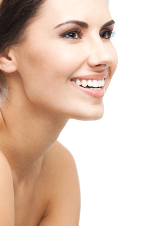 Close up portrait of beautiful young happy smiling womanの写真素材
