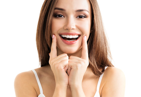 Young woman showing smile, in casual smart clothing, isolated against white background. Caucasian brunette model in emoshions and optimistic, positive, happy feeling concept studio shoot. Young woman showing smile, in casual smart clothing, isolated against white background. Caucasian brunette model in emoshions and optimistic, positive, happy feeling concept studio shoot.
