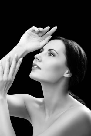 Glamorous portrait of beautiful young woman with naked shoulders. Black and white.の写真素材