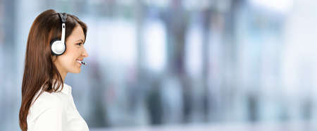 Call Center Service. Profile side face portrait image of customer support or answer worker, sales agent. Caller, receptionist phone female operator. Helpline answering and telemarketing. Copy space.の写真素材