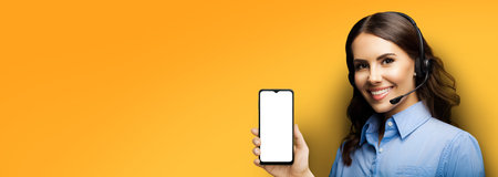 Customer support phone operator in headset holding showing smartphone cellphone mobile with white...